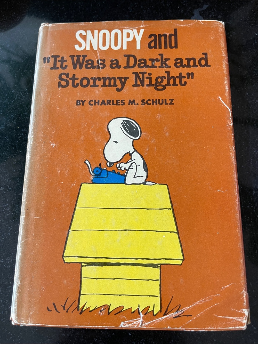 Snoopy "It Was a Dark and Stormy Night" Book - Orange & Yellow